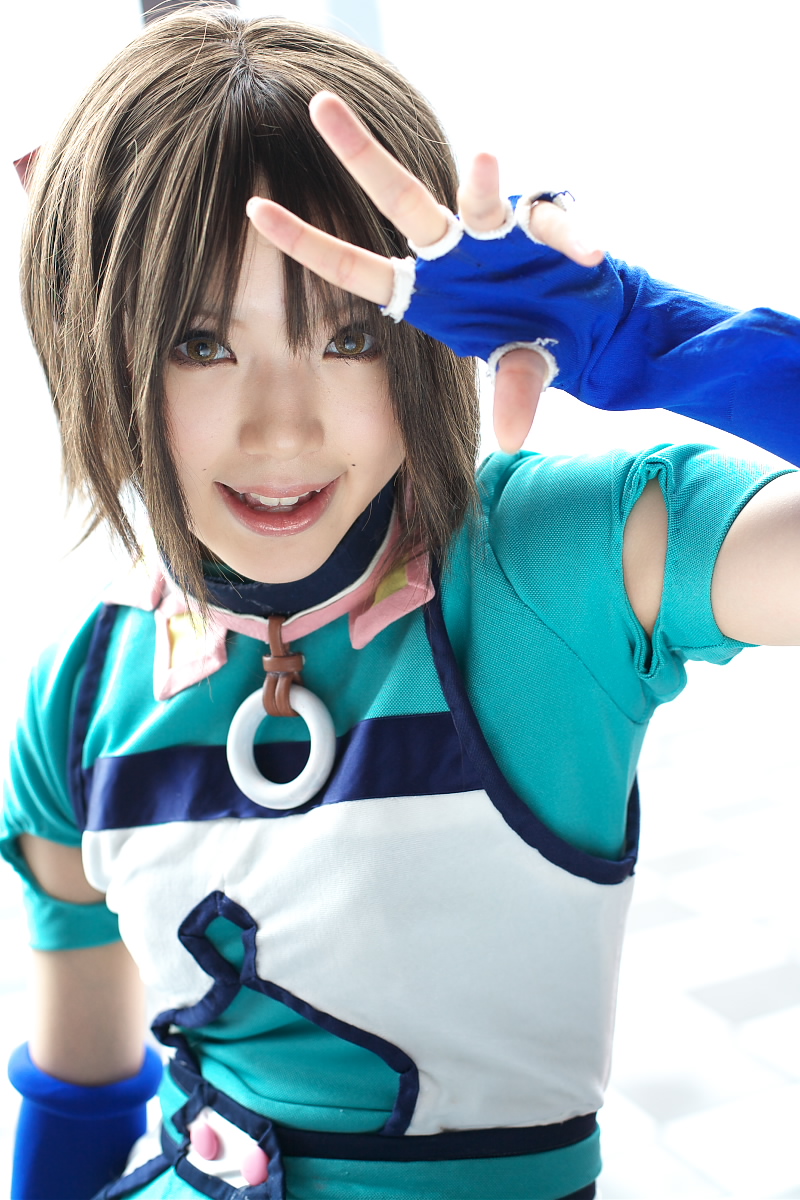 kipi-san, mel, gensou suikoden, gensou suikoden iii, highres, photo (medium), 1girl, asian, blue gloves, breasts, brown eyes, brown hair, cosplay, elbow gloves, female focus, fingerless gloves, gloves, looking at viewer, mel (cosplay), mole, short hair, small breasts, smile, solo
