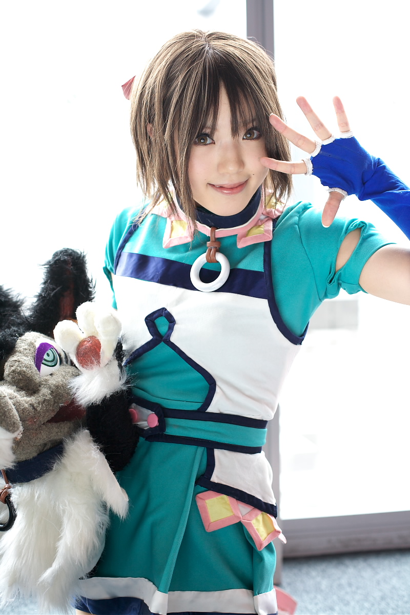 kipi-san, branky, mel, gensou suikoden, gensou suikoden iii, highres, photo (medium), 1girl, asian, blue gloves, breasts, brown eyes, brown hair, cosplay, elbow gloves, fingerless gloves, gloves, indoors, looking at viewer, mel (cosplay), mole, puppet, short hair, small breasts, smile, stuffed animal, stuffed toy