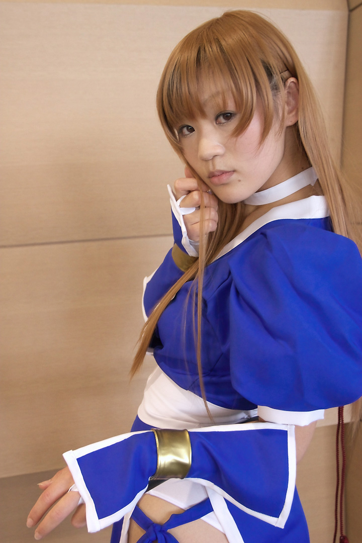azumi (cosplayer), kasumi (doa), dead or alive, tecmo, light brown hair, photo (medium), 1girl, asian, blonde hair, breasts, cosplay, female focus, indoors, kasumi (doa) (cosplay), long hair, looking at viewer, looking back, ninja, panties, pantyshot, pelvic curtain, serious, small breasts, solo, underwear, white panties