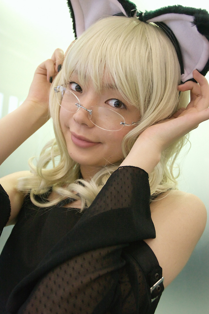 namada, elfriede, tsukuyomi moonphase, photo (medium), 1girl, animal ears, asian, bare shoulders, black dress, black nails, blonde hair, breasts, buckle, cat ears, cosplay, detached sleeves, dress, elfriede (cosplay), fake animal ears, female focus, glass wall, glasses, long hair, looking at viewer, looking over eyewear, mole, nail polish, reflection, rimless eyewear, see-through clothes, small breasts, solo, standing, upper body