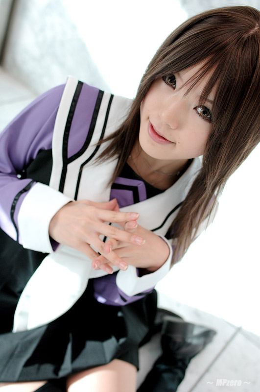 kipi-san, yoshizuki iori, i"s, photo (medium), 1girl, asian, brown eyes, brown hair, cosplay, female focus, looking at viewer, mole, school uniform, serafuku, sitting, solo, thighhighs, yokozuwari, yoshizuki iori (cosplay)