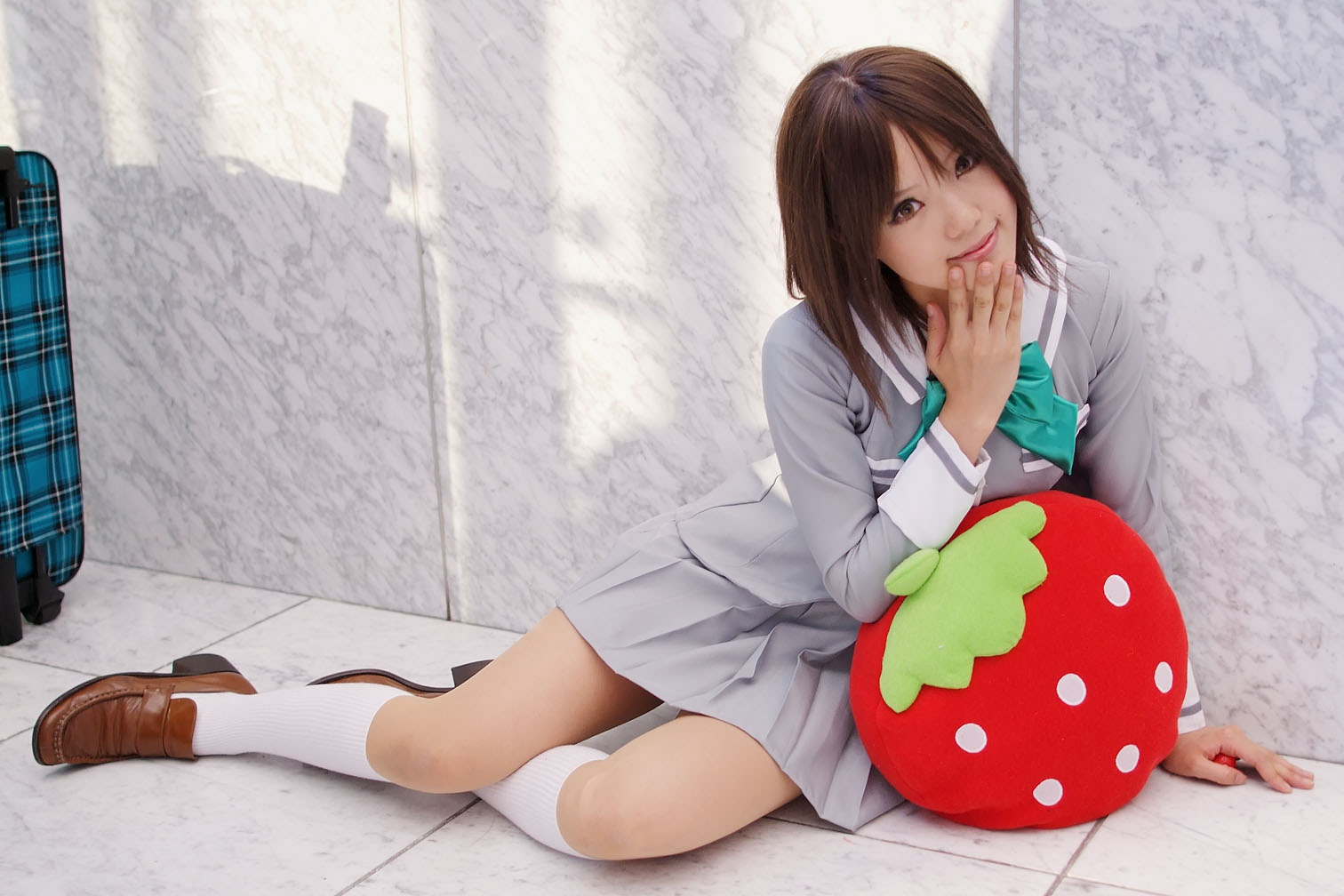 kipi-san, sotomura misuzu, ichigo 100%, photo (medium), 1girl, asian, brown eyes, brown hair, cosplay, female focus, loafers, looking at viewer, on floor, school uniform, shoes, sitting, socks, solo, sotomura misuzu (cosplay), strawberry-shaped pillow, white socks, yokozuwari