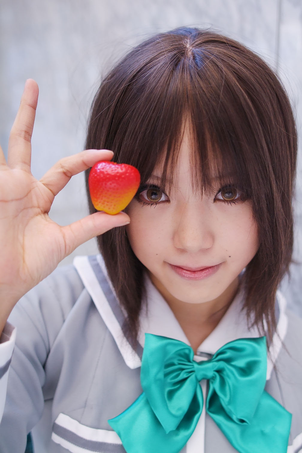 kipi-san, sotomura misuzu, ichigo 100%, highres, photo (medium), 1girl, asian, brown eyes, brown hair, cosplay, female focus, food, fruit, looking at viewer, school uniform, solo, sotomura misuzu (cosplay), strawberry