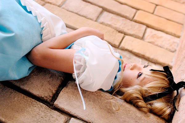 kipi-san, alice (alice in wonderland), alice's adventures in wonderland, photo (medium), 1girl, alice (alice in wonderland) (cosplay), apron, asian, blonde hair, breasts, cosplay, dutch angle, female focus, hair ribbon, long hair, petite, ribbon, small breasts, solo