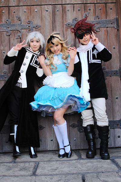 kipi-san, alice (alice in wonderland), alice's adventures in wonderland, real life, actress request, character request, photo (medium), 3girls, alice (alice in wonderland) (cosplay), apron, asian, blonde hair, breasts, cosplay, crossover, door, dutch angle, eyepatch, hair ribbon, interlocked fingers, long hair, looking at viewer, multiple girls, outdoors, petite, red hair, ribbon, small breasts, smile, socks, v, white hair