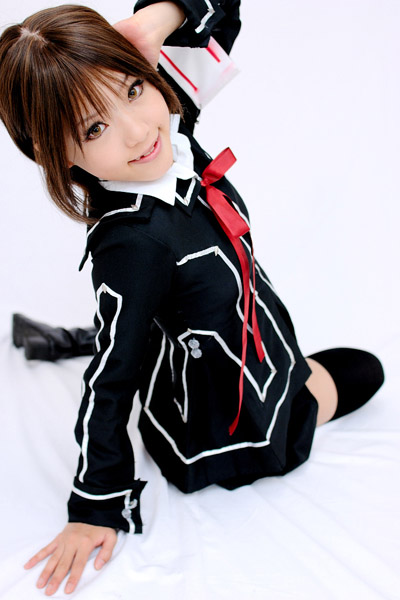 kipi-san, kurosu yuuki, vampire knight, photo (medium), 1girl, armband, asian, boots, brown eyes, brown hair, cosplay, female focus, kurosu yuuki (cosplay), looking at viewer, looking back, school uniform, short hair, simple background, solo, thighhighs, white background, zettai ryouiki