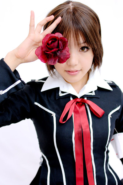 kipi-san, kurosu yuuki, vampire knight, photo (medium), 1girl, armband, asian, brown eyes, brown hair, cosplay, female focus, flower, kurosu yuuki (cosplay), looking at viewer, rose, school uniform, short hair, simple background, solo, white background