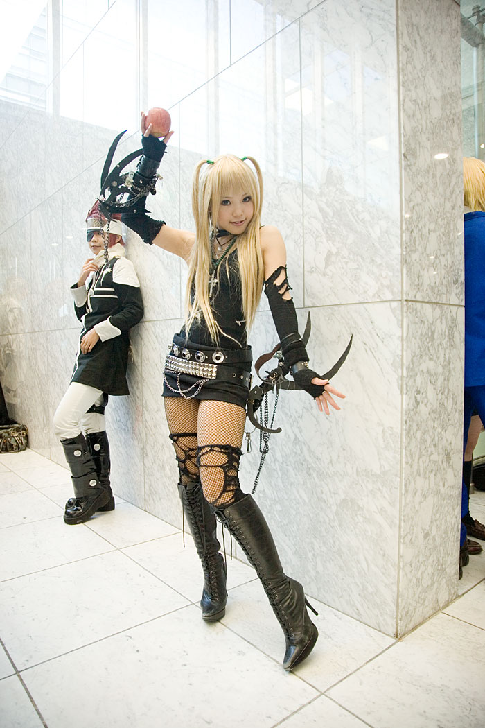 kipi-san, amane misa, lavi, d.gray-man, death note, blade, photo (medium), 1boy, 1girl, amane misa (cosplay), apple, asian, blonde hair, boots, breasts, choker, cosplay, cross, cross necklace, eyepatch, fingerless gloves, fishnet pantyhose, fishnets, food, fruit, gloves, indoors, jewelry, long hair, looking at viewer, miniskirt, necklace, pantyhose, skirt, small breasts, solo focus, thighhighs, torn clothes, two side up