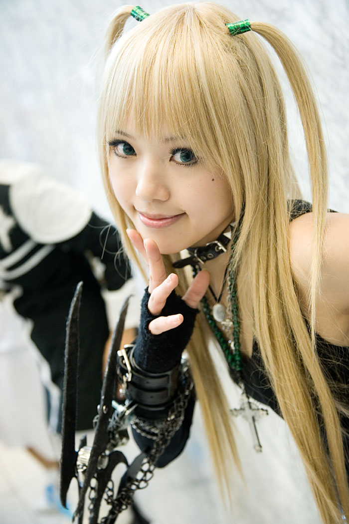 kipi-san, amane misa, death note, blade, photo (medium), 1girl, amane misa (cosplay), aqua eyes, asian, blonde hair, blue eyes, breasts, color contacts, cosplay, cross, cross necklace, dutch angle, elbow gloves, female focus, fingerless gloves, gloves, indoors, jewelry, long hair, looking at viewer, mole, necklace, small breasts, solo, two side up
