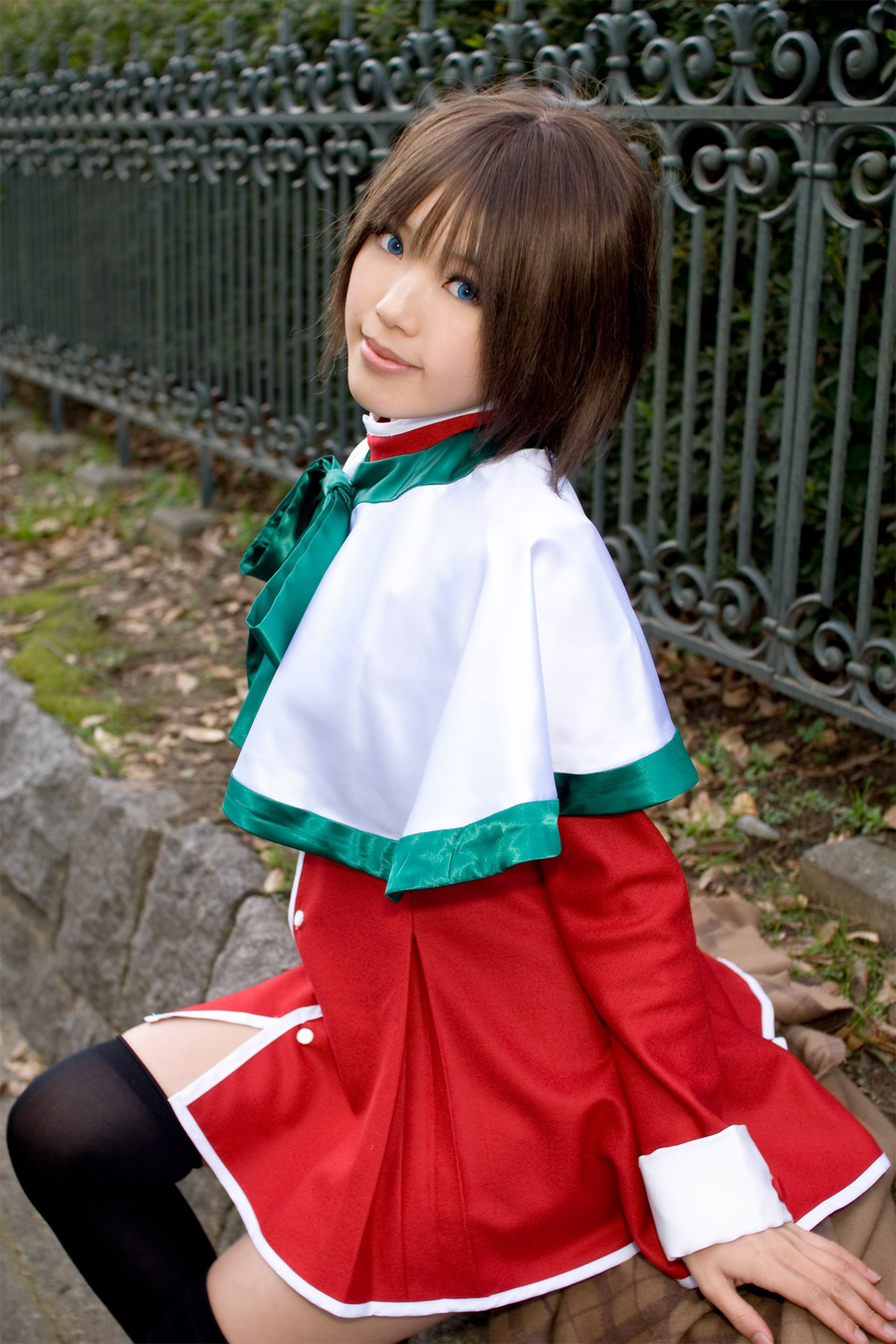 kipi-san, misaka shiori, kanon, highres, photo (medium), 1girl, asian, black thighhighs, blue eyes, brown hair, color contacts, cosplay, female focus, lipstick, looking at viewer, makeup, misaka shiori (cosplay), outdoors, park, school uniform, shawl, short hair, sitting, solo, thighhighs, zettai ryouiki