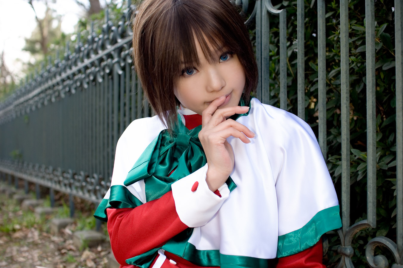 kipi-san, misaka shiori, kanon, photo (medium), 1girl, asian, blue eyes, brown hair, color contacts, cosplay, female focus, looking at viewer, misaka shiori (cosplay), outdoors, park, school uniform, shawl, short hair, sitting, solo