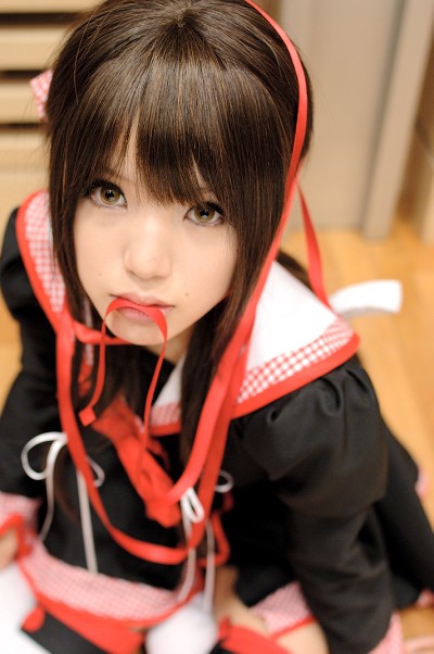 kipi-san, masuda shizuka, final approach, photo (medium), 1girl, asian, breasts, brown eyes, brown hair, cosplay, female focus, hair ribbon, indoors, long hair, looking at viewer, masuda shizuka (cosplay), mole, mouth hold, ribbon, sailor collar, school uniform, serafuku, small breasts, solo