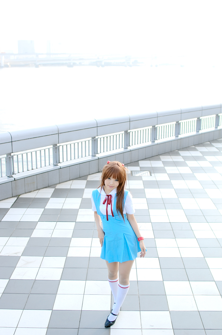 kipi-san, souryuu asuka langley, neon genesis evangelion, real life, cosplay photo, photo (medium), 1girl, asian, blue eyes, breasts, color contacts, cosplay, female focus, hairpods, kneehighs, long hair, looking at viewer, orange hair, outdoors, petite, school uniform, small breasts, socks, solo, souryuu asuka langley (cosplay), two side up, watch