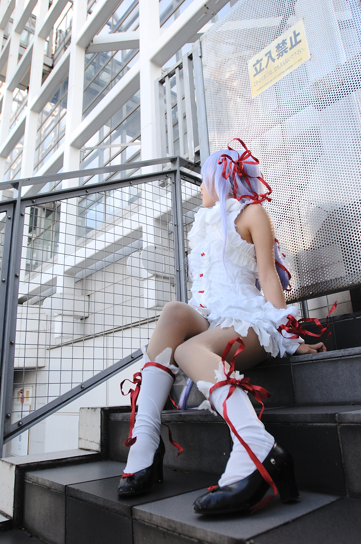 kipi-san, al azif (demonbane), demonbane, photo (medium), 1girl, al azif (cosplay), asian, cosplay, dress, female focus, frills, hair ribbon, outdoors, purple hair, ribbon, short dress, sitting, socks, solo, wrist cuffs