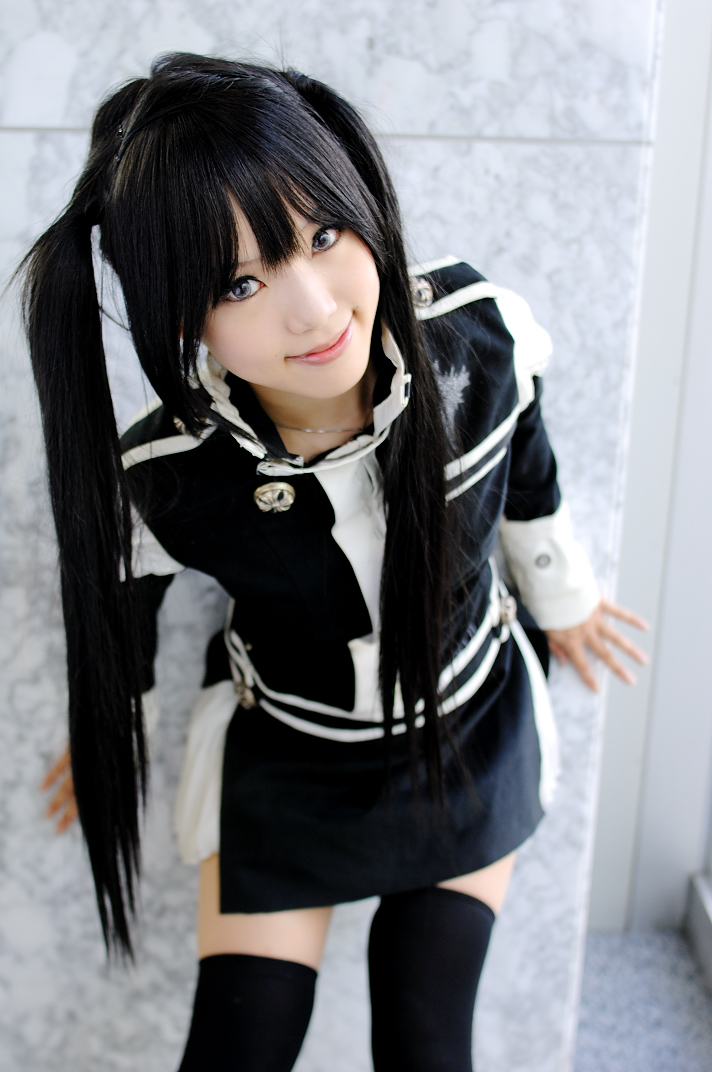 kipi-san, lenalee lee, d.gray-man, photo (medium), 1girl, asian, black hair, black thighhighs, blue eyes, breasts, color contacts, cosplay, dutch angle, female focus, indoors, leaning forward, lenalee lee (cosplay), long hair, looking at viewer, petite, small breasts, smile, solo, thighhighs, twintails, zettai ryouiki