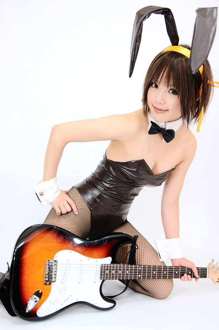 kipi-san, suzumiya haruhi, suzumiya haruhi no yuuutsu, photo (medium), 1girl, animal ears, asian, breasts, brown eyes, brown hair, cleavage, cosplay, fake animal ears, female focus, fishnet pantyhose, fishnets, guitar, hair ribbon, hairband, instrument, leotard, looking at viewer, pantyhose, playboy bunny, rabbit ears, ribbon, simple background, small breasts, solo, suzumiya haruhi (cosplay), white background