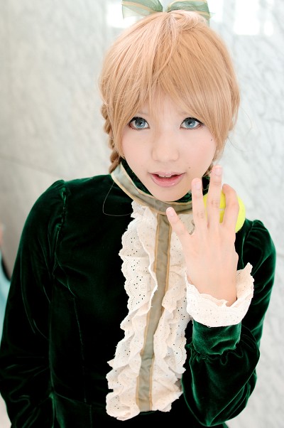 kipi-san, maki saori (swk), smash wo kimero!, nylons, photo (medium), 1girl, asian, ball, blonde hair, blue eyes, braid, color contacts, cosplay, dress, female focus, green dress, looking at viewer, maki saori (swk) (cosplay), mole, solo, tennis ball, twin braids, velvet dress