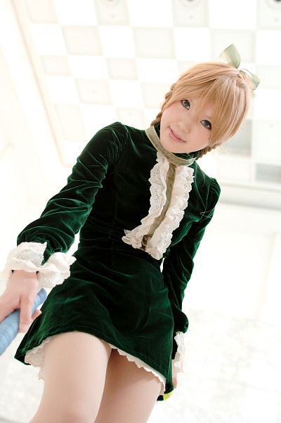 kipi-san, maki saori (swk), smash wo kimero!, nylons, photo (medium), 1girl, asian, blonde hair, blue eyes, braid, ceiling, color contacts, cosplay, dress, female focus, from below, green dress, indoors, looking at viewer, maki saori (swk) (cosplay), short dress, solo, twin braids, velvet dress