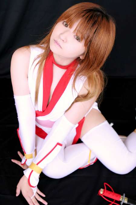 mizuhara arisa, kasumi (doa), dead or alive, tecmo, photo (medium), tagme, 1girl, arm support, asian, black background, cosplay, female focus, kasumi (doa) (cosplay), long hair, looking at viewer, simple background, sitting, solo, thighhighs, weapon, white thighhighs, yokozuwari