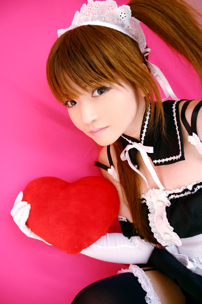 mizuhara arisa, sawatari mitsuki, kore ga watashi no goshujin-sama, photo (medium), tagme, 1girl, apron, asian, bare shoulders, black thighhighs, brown hair, cosplay, detached collar, dyed hair, elbow gloves, female focus, garter straps, gloves, heart, japanese (nationality), looking at viewer, maid, maid headdress, nakabayashi yoshitaka's maid uniform, pink background, sawatari mitsuki (cosplay), simple background, solo, thighhighs, twintails, waist apron, white apron, white gloves