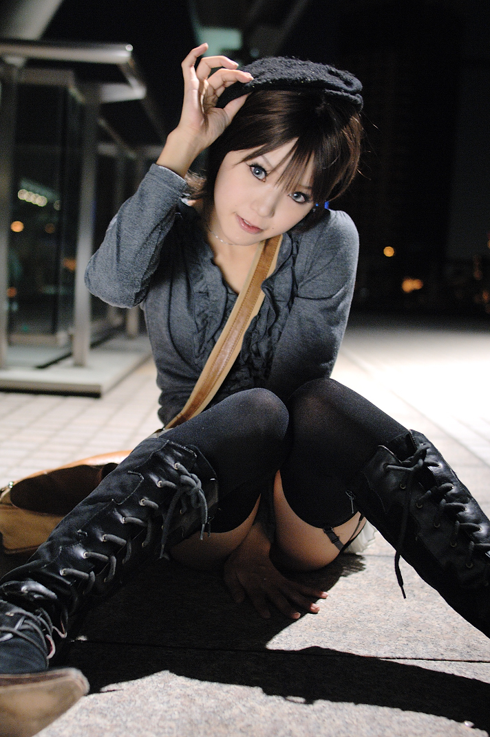 kipi-san, photo (medium), 1girl, asian, bag, beret, black thighhighs, blue eyes, boots, breasts, brown hair, color contacts, convenient censoring, female focus, garter straps, grey eyes, hat, knees together feet apart, lace-up boots, looking at viewer, miniskirt, mole, night, on floor, on ground, outdoors, sitting, skirt, small breasts, solo, thighhighs