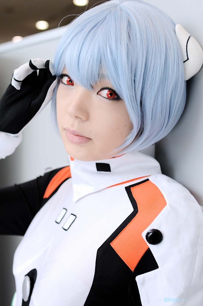 namada, ayanami rei, neon genesis evangelion, photo (medium), 1girl, against wall, asian, blue hair, color contacts, cosplay, female focus, hairpods, leaning back, looking at viewer, makeup, mascara, mecha pilot suit, plugsuit (cosplay), plugsuit (evangelion), short hair, solo, standing