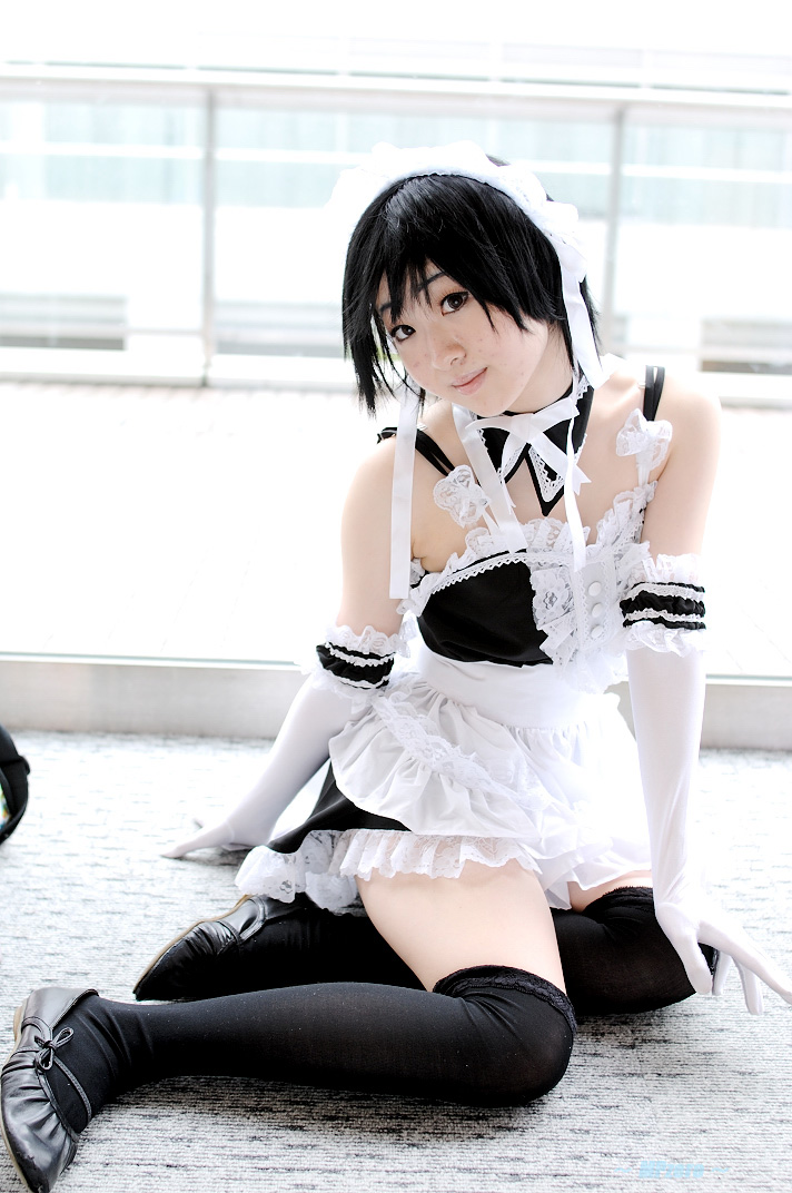 minami riko, sawatari izumi, kore ga watashi no goshujin-sama, photo (medium), 1girl, apron, asian, bare shoulders, black hair, black shoes, black thighhighs, carpet, cosplay, detached collar, elbow gloves, facing viewer, female focus, full body, gloves, indoors, japanese (nationality), looking at viewer, maid, maid apron, maid headdress, nakabayashi yoshitaka's maid uniform, on floor, sawatari izumi (cosplay), shoes, short hair, sitting, solo, thighhighs, waist apron, white apron, white gloves, window, yokozuwari