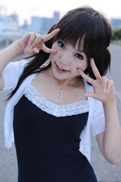 kipi-san, photo (medium), tagme, 1girl, asian, breasts, cardigan, contrapposto, double v, female focus, jewelry, looking at viewer, mole, outdoors, pendant, small breasts, solo, twintails, v