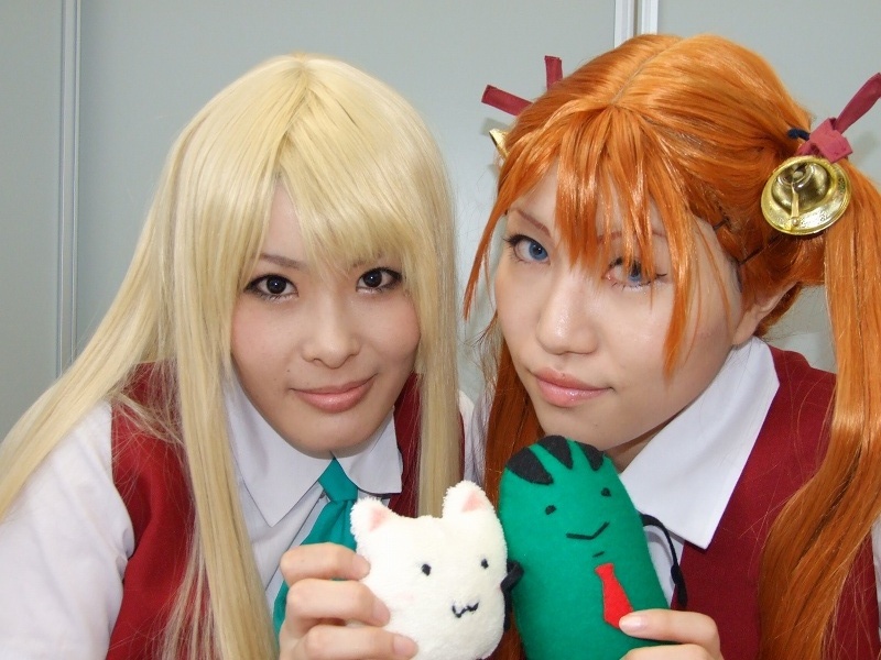 mio (cosplayer), rou (cosplayer), kagurazaka asuna, yukihiro ayaka, mahou sensei negima!, photo (medium), 2girls, bell, blonde hair, cosplay, hair ribbon, kneehighs, multiple girls, ribbon, school uniform, socks, stuffed animal, stuffed toy, twintails