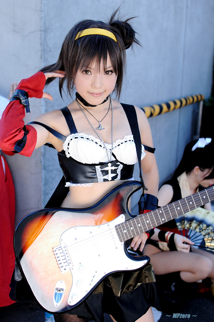 kipi-san, suzumiya haruhi, real life, suzumiya haruhi no yuuutsu, fishnet legwear, cosplay photo, photo (medium), 1girl, asian, belt, breasts, cosplay, elbow gloves, electric guitar, female focus, fender stratocaster, fishnets, gloves, guitar, hairband, instrument, looking at viewer, midriff, small breasts, solo, suzumiya haruhi (cosplay)