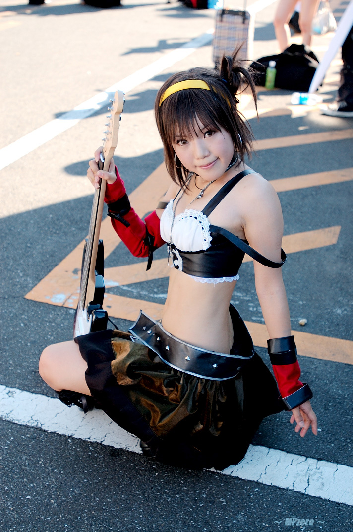 kipi-san, suzumiya haruhi, suzumiya haruhi no yuuutsu, fishnet legwear, photo (medium), 1girl, asian, belt, breasts, cosplay, elbow gloves, female focus, fishnets, gloves, guitar, hairband, instrument, looking at viewer, midriff, outdoors, small breasts, solo, squatting, suzumiya haruhi (cosplay)