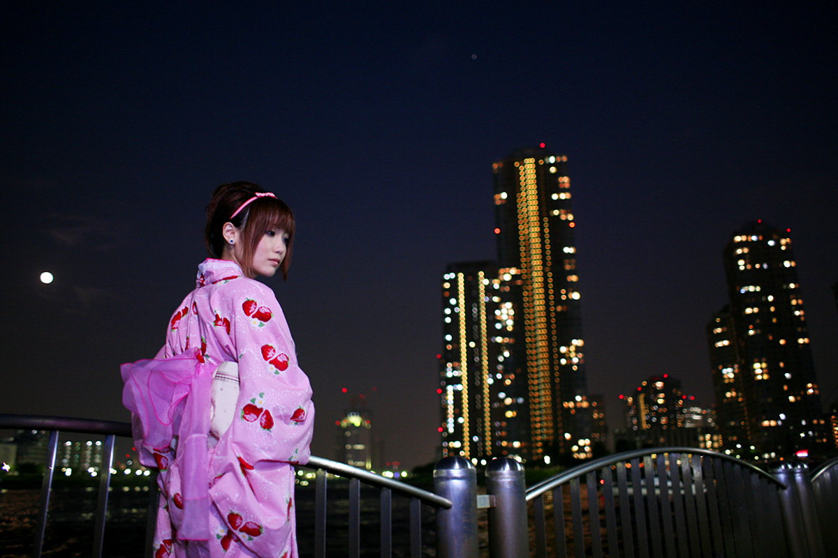 shio, photo (medium), 1girl, cityscape, female focus, hairband, japanese clothes, kimono, night, sky, solo, strawberry pattern, waterfront