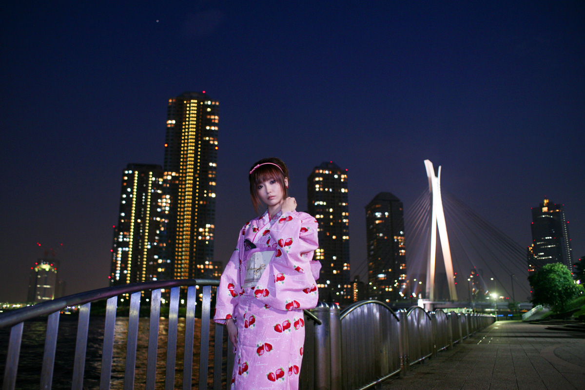 shio, photo (medium), 1girl, cityscape, female focus, hairband, japanese clothes, kimono, night, sky, solo, strawberry pattern, water, waterfront