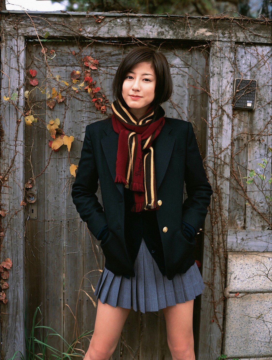 sugimoto yumi, highres, photo (medium), 1girl, asian, blazer, brown hair, cardigan, cosplay, female focus, jacket, long hair, looking at viewer, miniskirt, pleated skirt, scarf, school uniform, skirt, solo