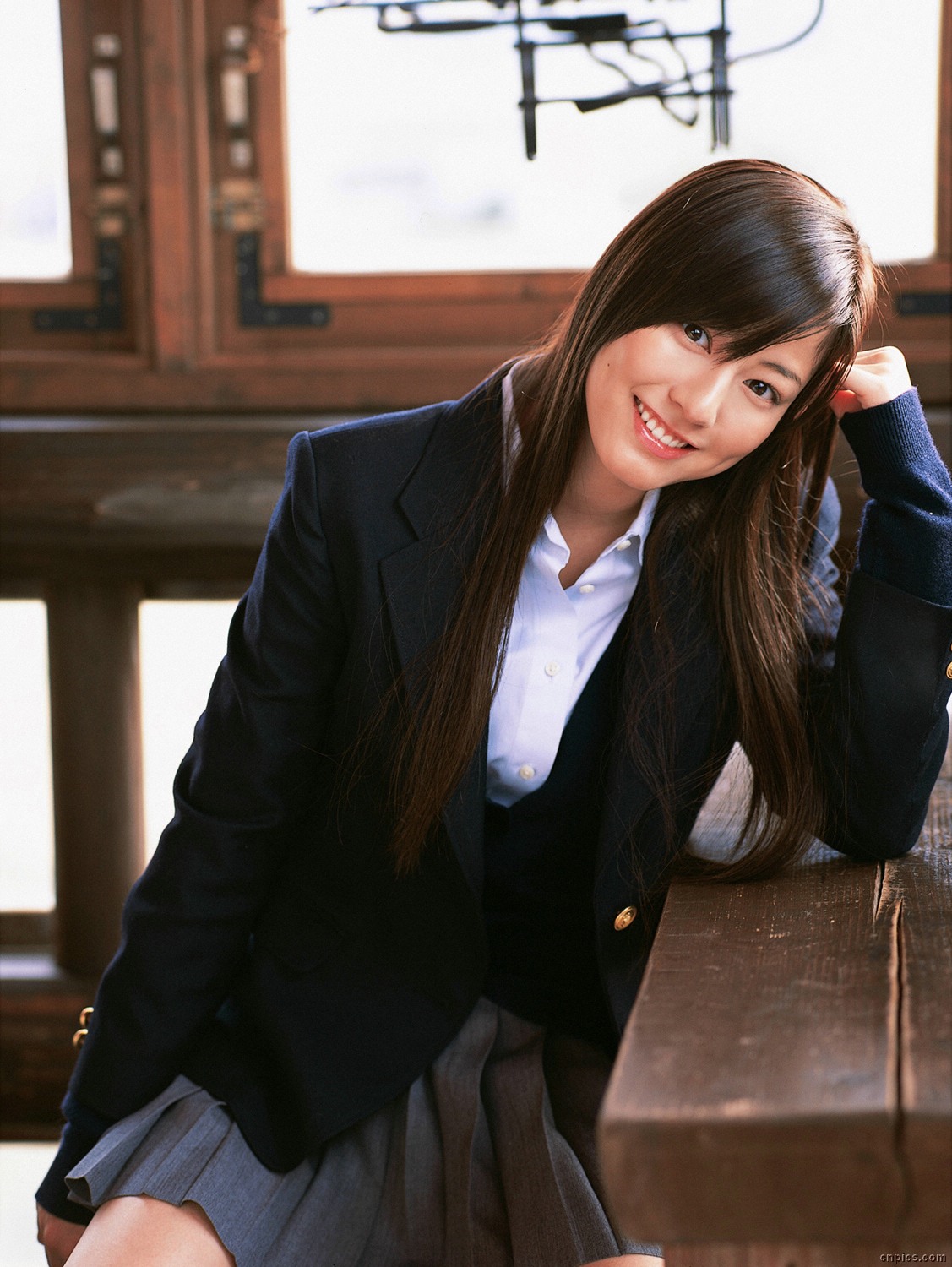 sugimoto yumi, highres, photo (medium), 1girl, asian, blazer, brown hair, cardigan, cosplay, female focus, indoors, jacket, long hair, looking at viewer, miniskirt, pleated skirt, school uniform, skirt, smile, solo