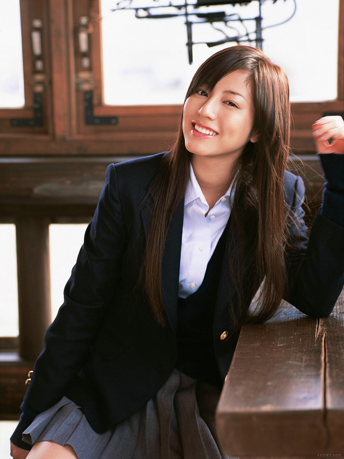 sugimoto yumi, highres, photo (medium), 1girl, asian, blazer, brown hair, cardigan, cosplay, female focus, indoors, jacket, long hair, looking at viewer, miniskirt, pleated skirt, school uniform, skirt, smile, solo