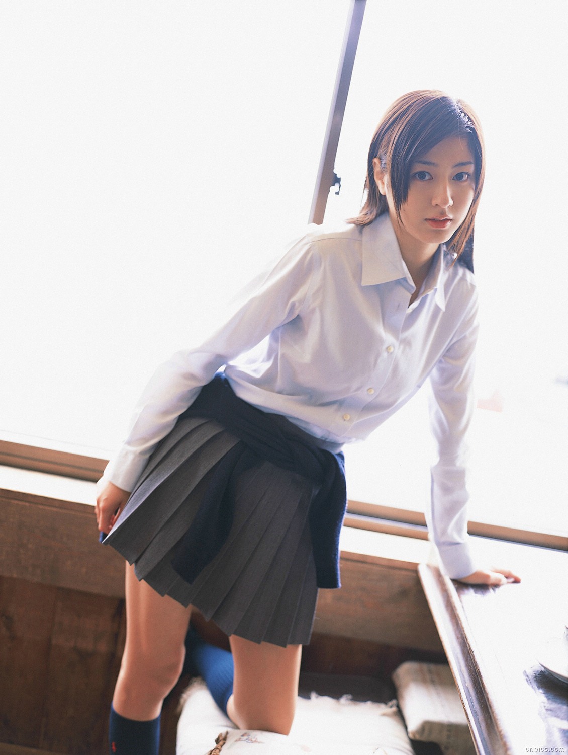 sugimoto yumi, highres, photo (medium), 1girl, asian, brown hair, cardigan, cosplay, dutch angle, female focus, indoors, kneehighs, long hair, looking at viewer, miniskirt, pleated skirt, school uniform, skirt, socks, solo