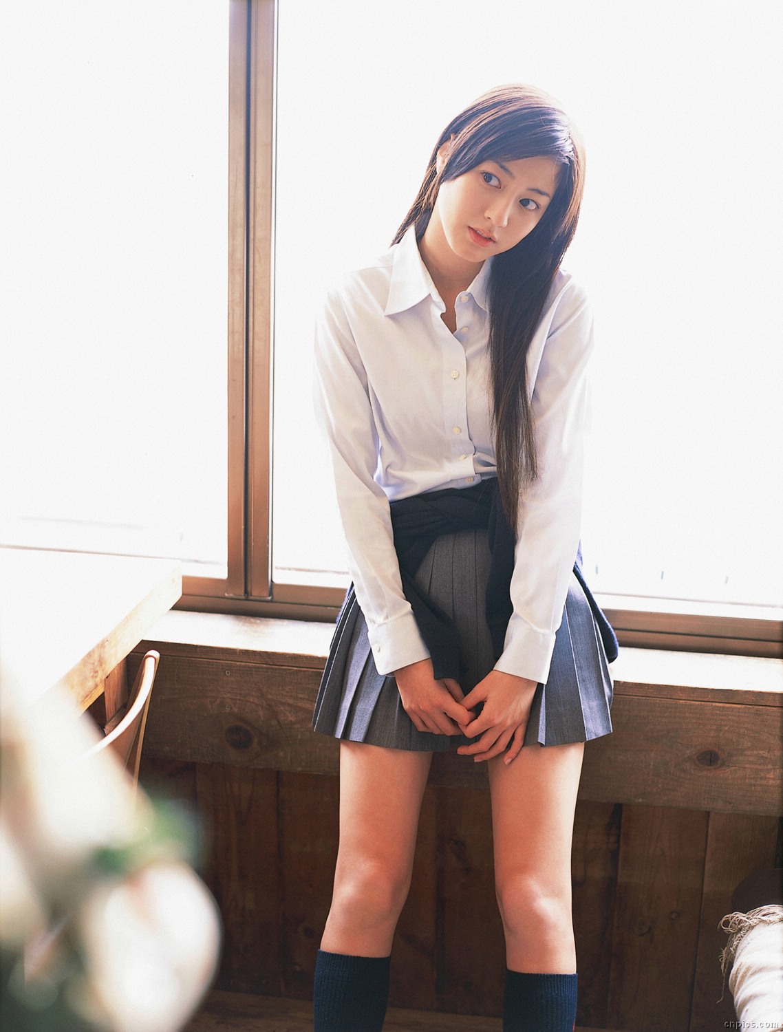 sugimoto yumi, highres, photo (medium), 1girl, asian, brown hair, cardigan, cosplay, female focus, indoors, kneehighs, long hair, looking at viewer, miniskirt, pleated skirt, school uniform, skirt, socks, solo