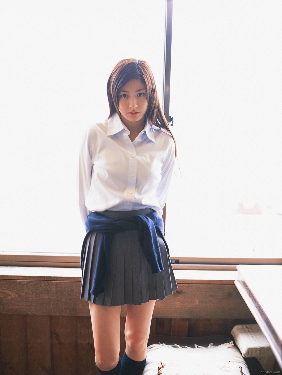 sugimoto yumi, highres, photo (medium), 1girl, asian, brown hair, cardigan, cosplay, female focus, indoors, kneehighs, long hair, looking at viewer, miniskirt, pleated skirt, school uniform, skirt, socks, solo