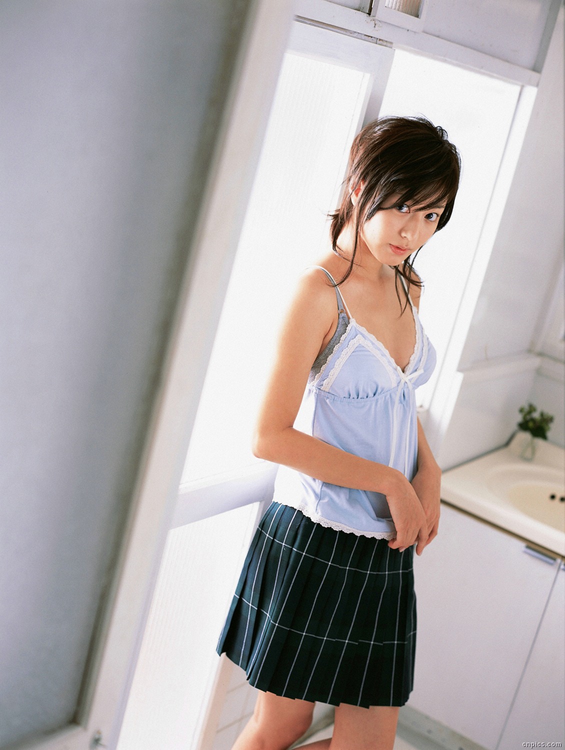sugimoto yumi, highres, photo (medium), 1girl, asian, bra, brown hair, camisole, dutch angle, female focus, indoors, lingerie, long hair, looking at viewer, miniskirt, pleated skirt, skirt, solo, underwear