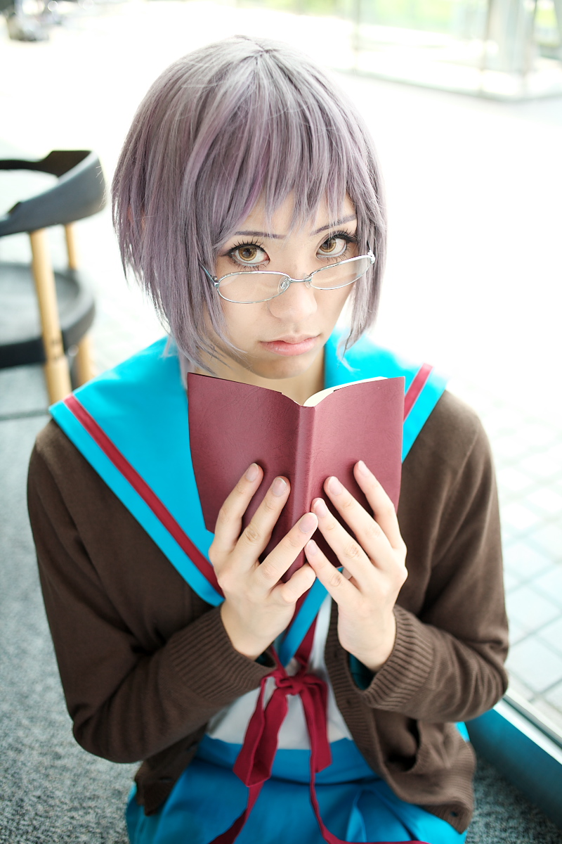 nagato yuki, suzumiya haruhi no yuuutsu, highres, photo (medium), book, cardigan, cosplay, glasses, sailor, school uniform, serafuku, tamaki shuri