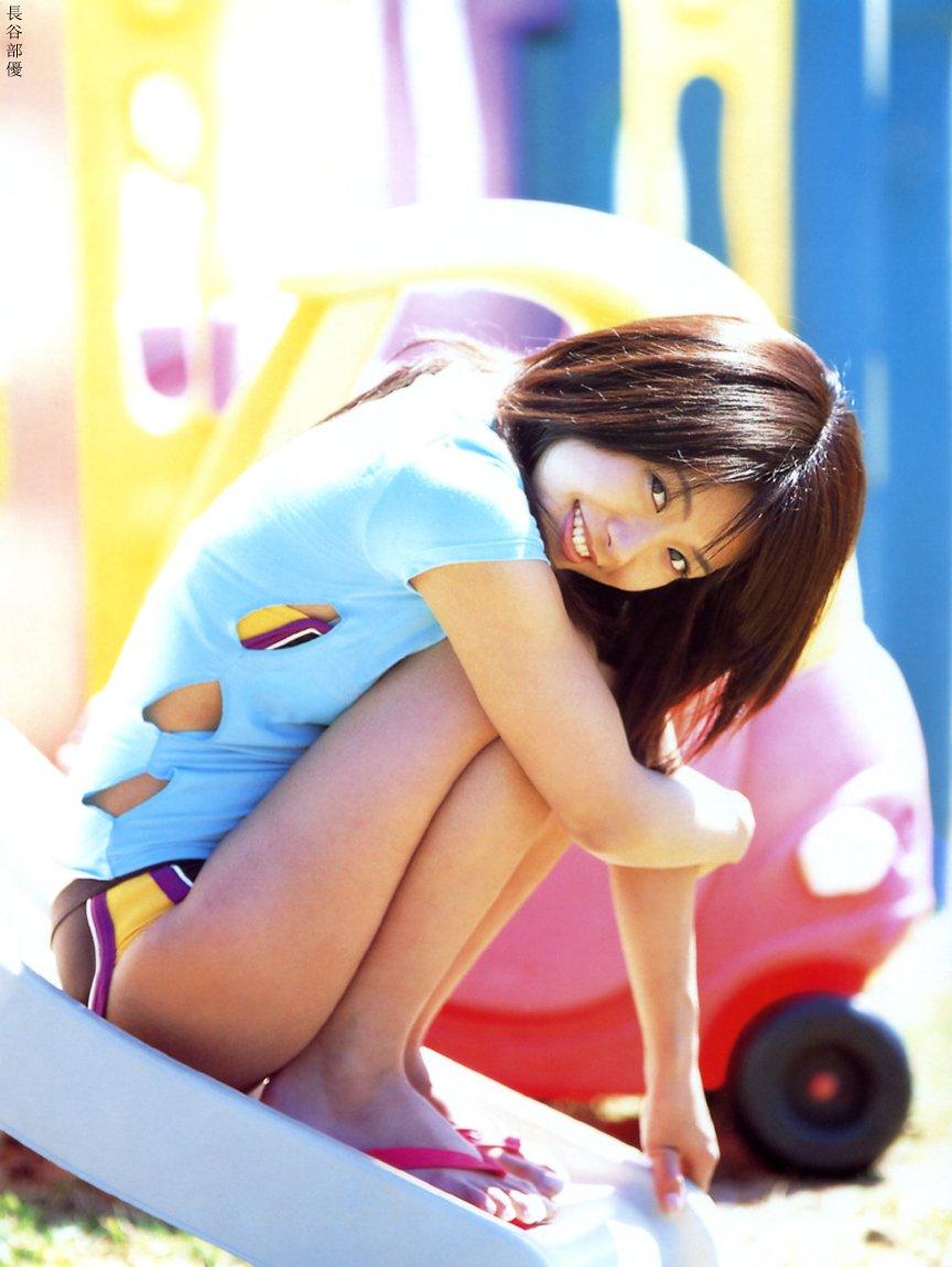 hasebe yu, photo (medium), 1girl, asian, bikini, blurry, breasts, depth of field, dutch angle, female focus, flip-flops, happy, long hair, looking at viewer, sandals, shirt, slide, small breasts, solo, swimsuit, t-shirt