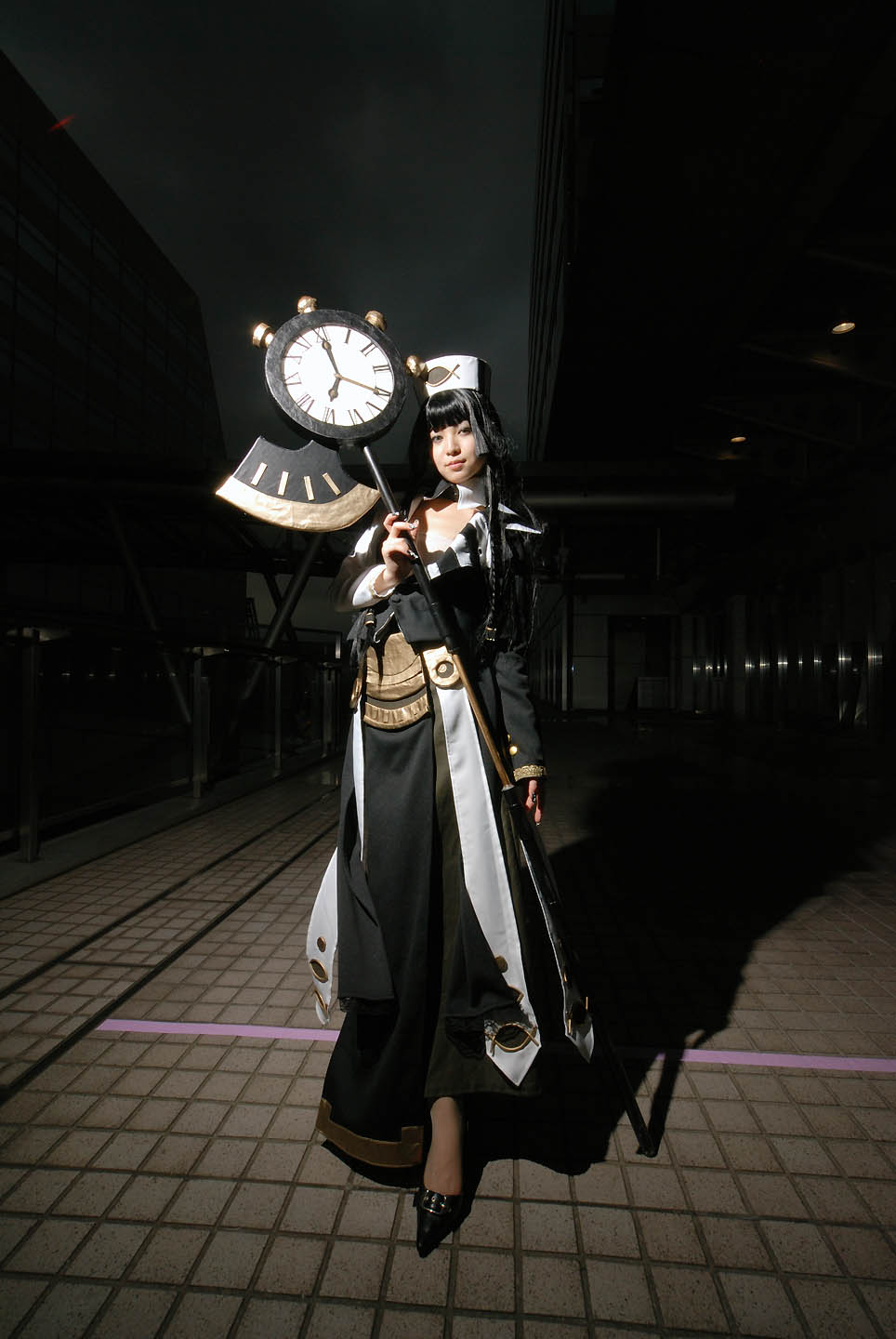 aida yukiko, eclipse (trickster), trickster (ntreev soft), cosplay photo, highres, photo (medium), 1girl, black hair, clock, cosplay, eclipse, female focus, long hair, looking at viewer, roman numeral, scythe, solo