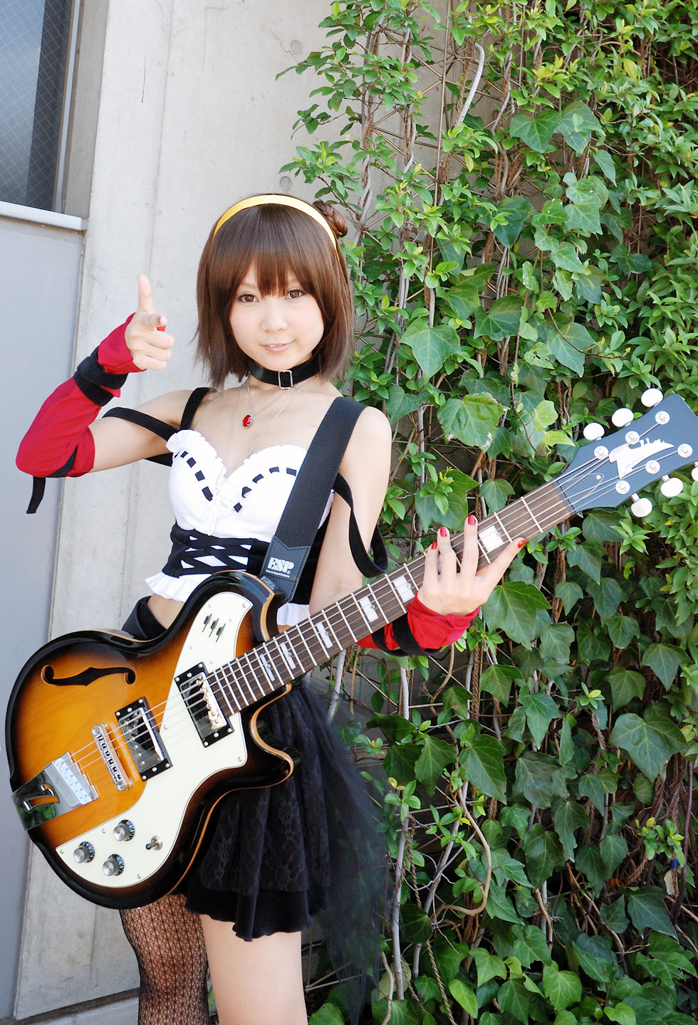 hiromichi, suzumiya haruhi, suzumiya haruhi no yuuutsu, fishnet legwear, highres, photo (medium), belt, cosplay, elbow gloves, fishnets, gloves, guitar, hairband, instrument, kneehighs, single kneehigh, single sock, single thighhigh, socks, thighhighs