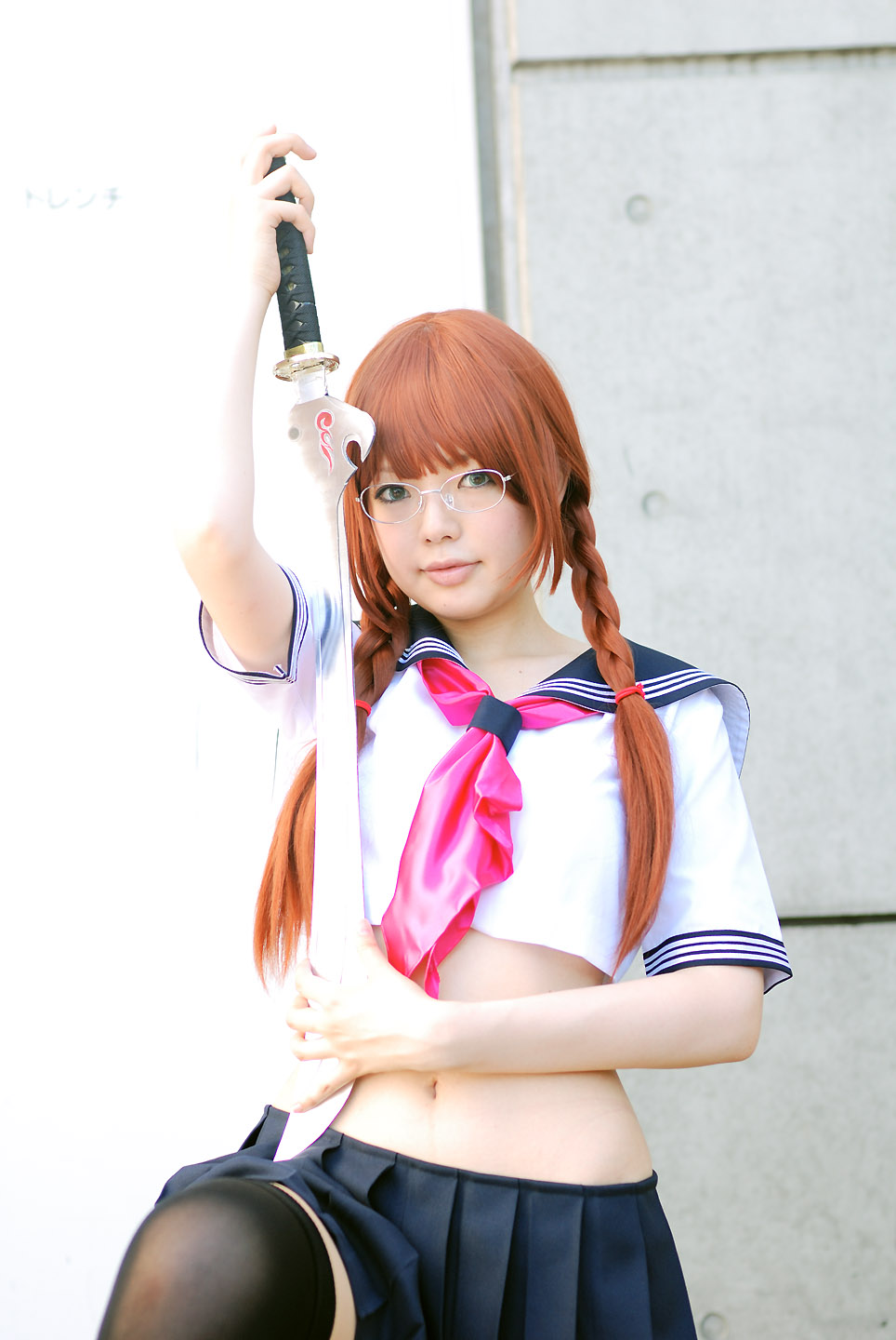 namada, arisugawa shii, the art of yamashita shunya, highres, photo (medium), 1girl, aqua eyes, arisugawa shii (cosplay), asian, black thighhighs, blue eyes, blurry, braid, brown hair, color contacts, cosplay, crop top, depth of field, female focus, glasses, green eyes, lensless glasses, long hair, looking at viewer, midriff, miniskirt, pleated skirt, sailor, school uniform, serafuku, short sleeves, skirt, solo, sword, thighhighs, twin braids, weapon, zettai ryouiki
