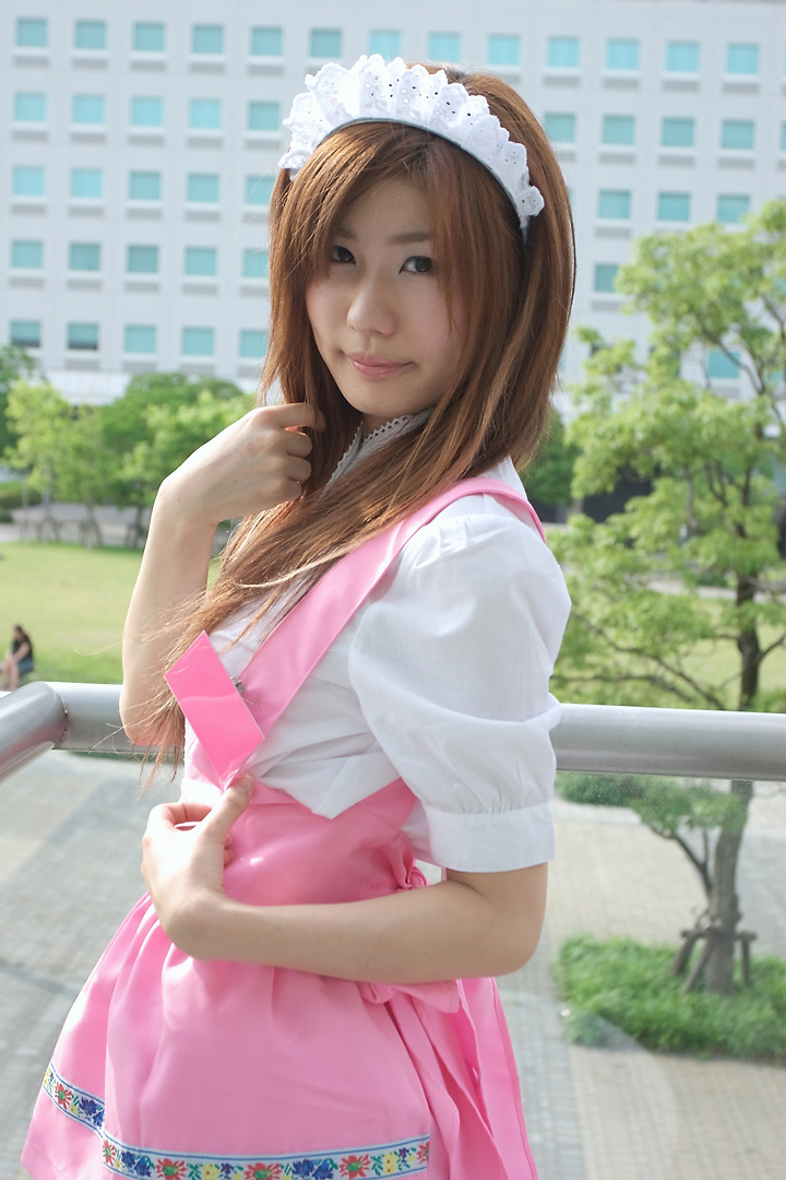 adachi mikki, anna miller, photo (medium), 1girl, apron, asian, blurry, brown hair, cosplay, depth of field, dyed hair, female focus, looking at viewer, outdoors, solo, thighhighs, waitress, waitress uniform