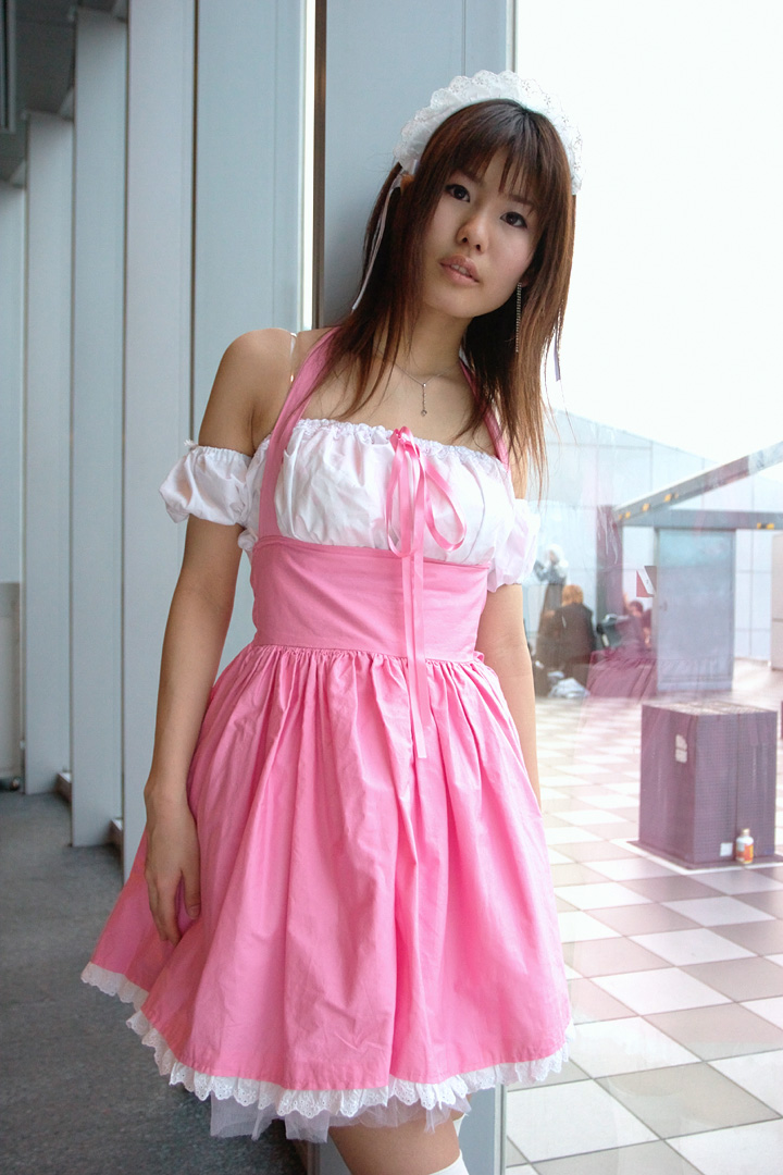adachi mikki, photo (medium), 1girl, asian, bare shoulders, brown hair, dress, dyed hair, female focus, hair ribbon, hairband, indoors, jewelry, looking at viewer, necklace, ribbon, solo, thighhighs, waitress uniform, white thighhighs, zettai ryouiki
