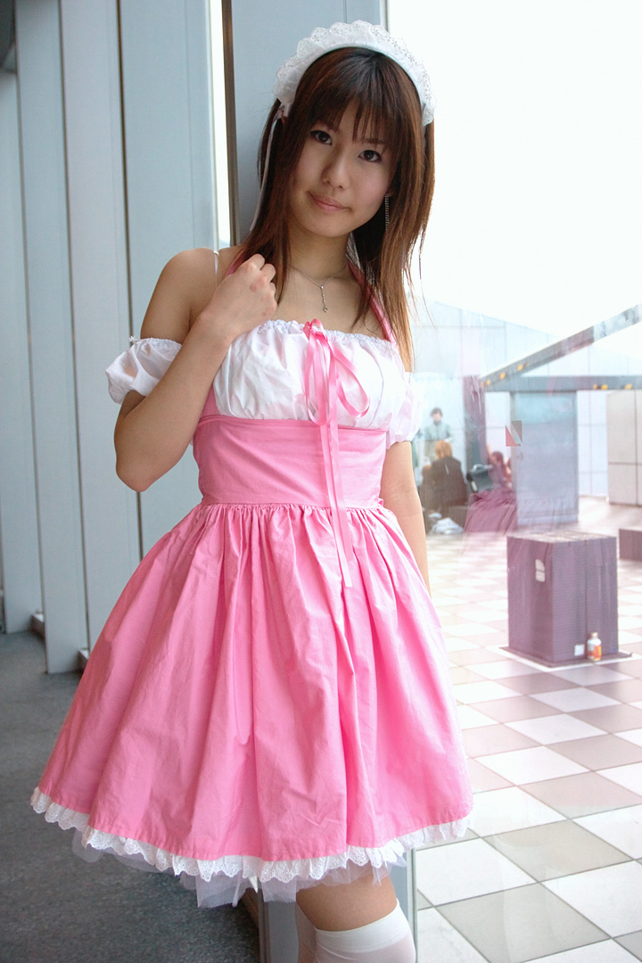 adachi mikki, photo (medium), 1girl, asian, bare shoulders, brown hair, dress, dyed hair, female focus, hair ribbon, hairband, indoors, jewelry, looking at viewer, necklace, ribbon, solo, thighhighs, waitress uniform, white thighhighs, zettai ryouiki