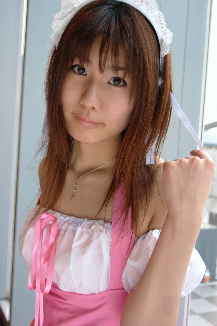 adachi mikki, photo (medium), 1girl, asian, bare shoulders, brown hair, dress, dyed hair, female focus, hair ribbon, hairband, indoors, jewelry, looking at viewer, necklace, ribbon, solo, waitress uniform