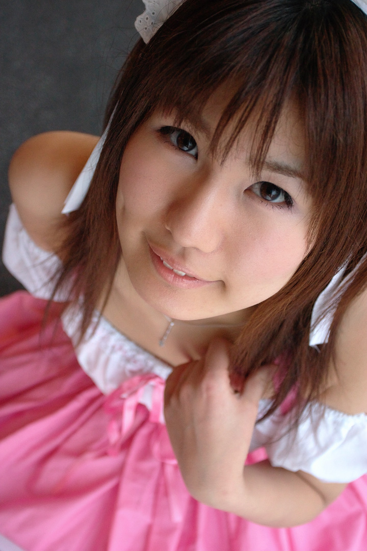 adachi mikki, photo (medium), 1girl, asian, bare shoulders, blurry, brown hair, depth of field, dress, dyed hair, female focus, hair ribbon, hairband, indoors, jewelry, looking at viewer, necklace, ribbon, solo, waitress uniform